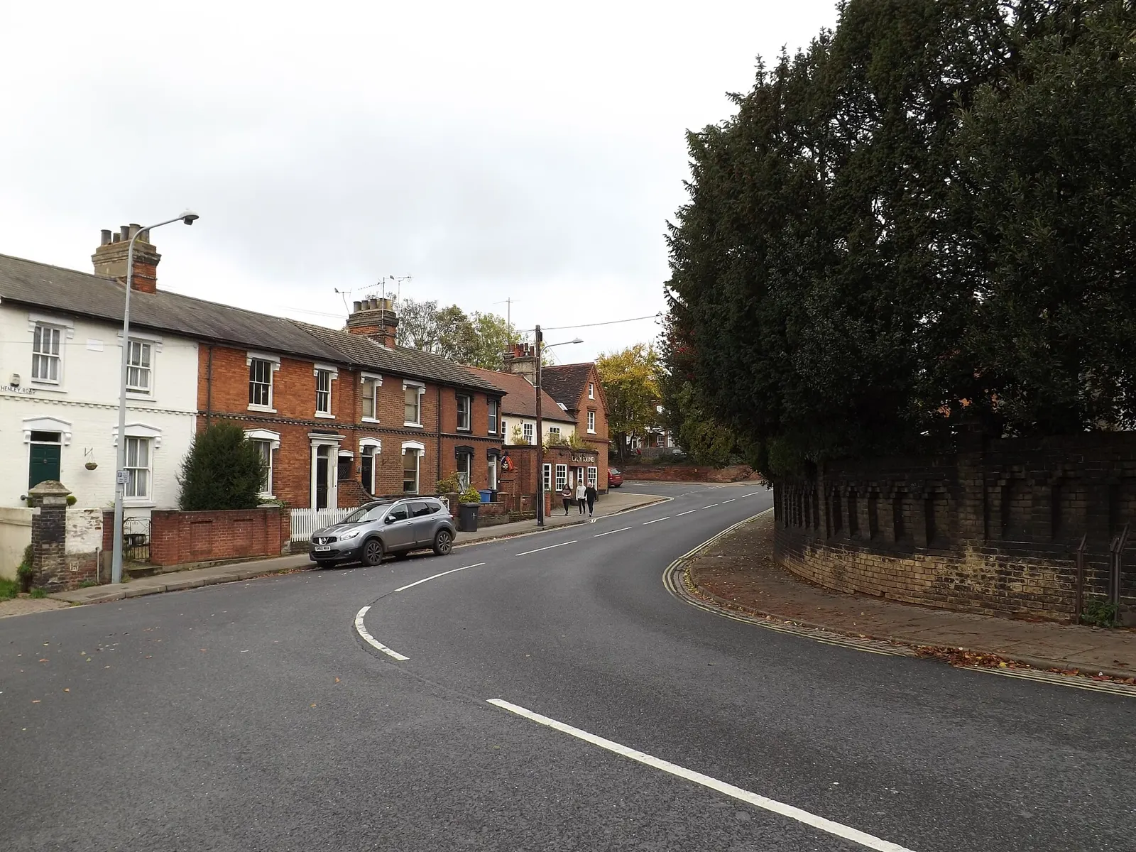 A row of Victorian terraced houses with chimneys on Henley Road, Ipswich